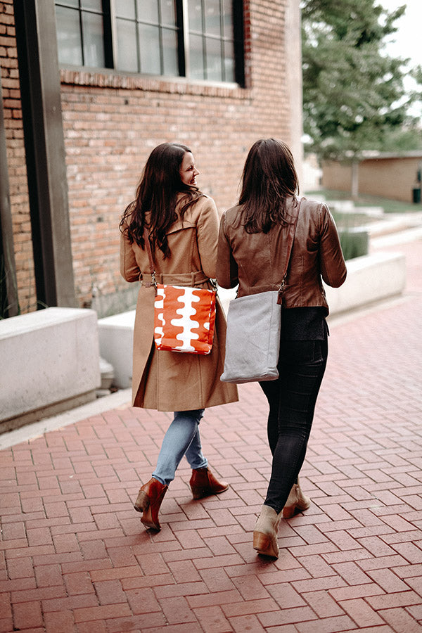 The Cloud Cross Body Travel Bag in Coral Tangerine